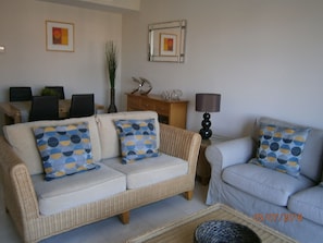 Lounge area with Flat screen TV with multi language channels, DVD & WiFi.
