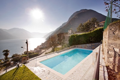Argegno Pool Apartment. Modern 180 degree panoramic 2 bedroom lake view home. 
