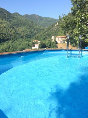 pool overlooking village and mountains