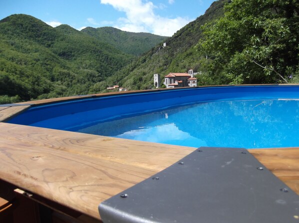 pool with view of mountains and village