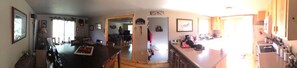 panoramic photo of living room into kitchen/dining