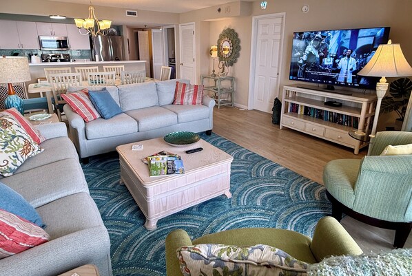 60" HDTV for all to enjoy, two full sofas and table for eight. 