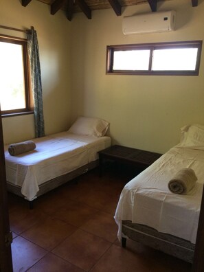 Bedroom #2 with 2 single beds and a/c