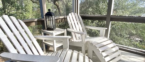 Screened in porch overlooking creek views