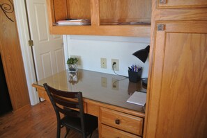 Desk with lighting, shelves and cabinets