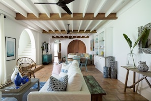 Large living space with game table and plenty of games and books for everyone.