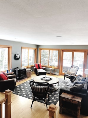 Fireplace, living room and large sliding doors to the new patio deck