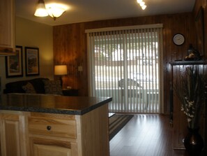 Open Concept from dining area to kitchen to living room..  Patio door to porch.