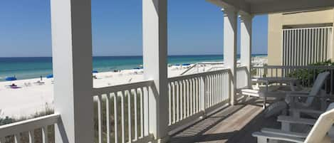 Seating and view from gulf front deck off main level. Watch the beach from deck.