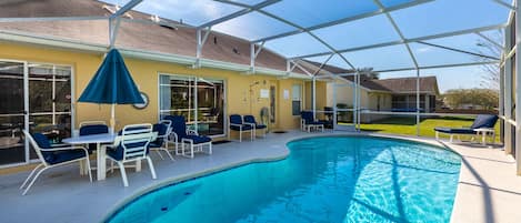 Pool during the day with plenty of space between houses.