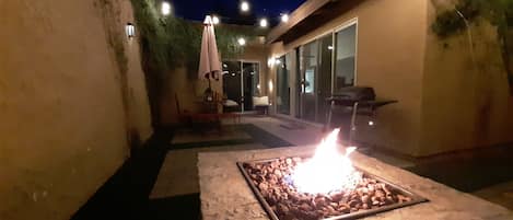 BBQ or enjoy a glass of wine out on the large private patio area w/ party lights