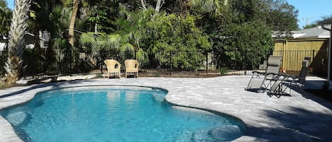 our new back yard pool - fully fenced in with new pavers and landscaping.