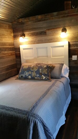 Queen bed in bedroom.