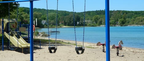 public park with sandy beach is next to the cottage