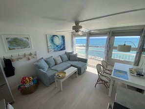 Living room looks out over protected sand-beach lagoon & ocean