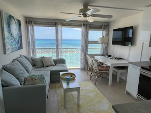 Living room looks out over protected sand-beach lagoon & ocean