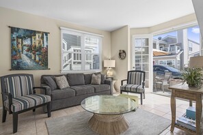 View of living space from the main entry door. Open floor plan between living, kitchen and dining areas.
                