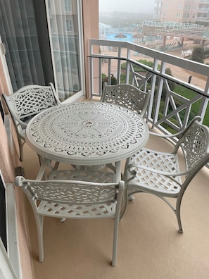 New table and chairs on the balcony. Umbrella is inside if you need it.