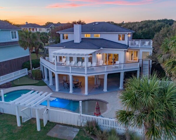 Back of house with ocean views