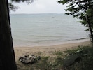 Private sandy beach with floating raft.