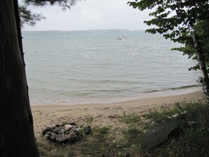Private sandy beach with floating raft.