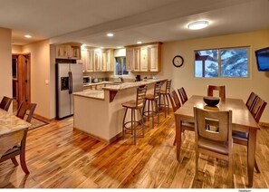 View from front door entering kitchen. Note Costa Rican Walnut hardwood floors.