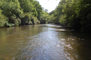 View downstream shows river's solace in summer.