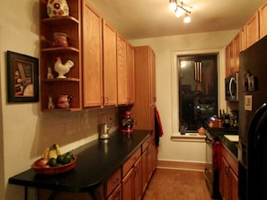 Brand new kitchen with fully stocked cabinets.