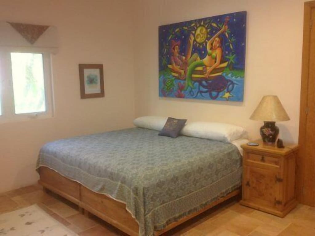 King bed, private bath, and local art!  Sweet dreams!