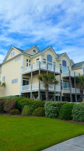 Oceanside of the townhome with large windows for lots of sunshine and views  