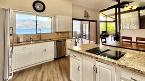 Great views from the kitchen and dining room, granite countertops, lots of light, with easy access to the deck and BBQ