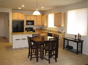 kitchen with stools-island bar / kitchen dining area - warm and cozy