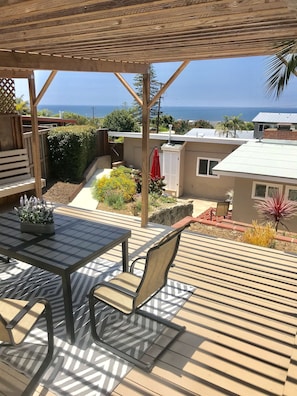 Beautiful ocean views from covered deck.
Backyard is on a hill with some steps.