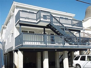 Back view of the condo hilighting the deck and parking.