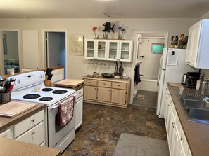 fully stocked kitchen with all your cooking pots, pan and utencils you will need