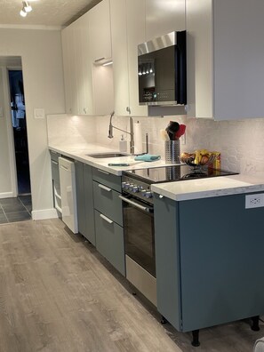 New cabinets, appliances, lighting, countertop