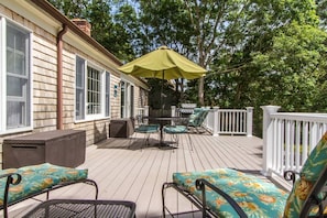 Onto a killer deck with 3 seating areas and a grill.