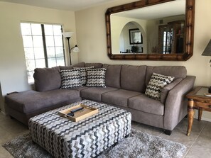 Comfortable Sectional and Ottoman in Living Room