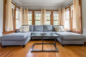 Sundrenched living room with large comfy sectional