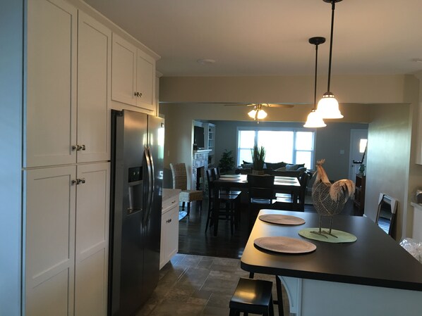 Back Door entrance into the open concept kitchen.