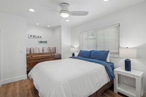 Queen bed, small twin daybed (a few inches shorter than normal twin), closet, TV