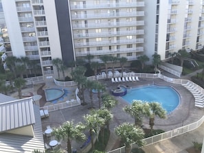 Pool with kiddie pool area and hot tub.