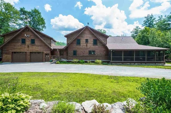 Log Home front entrance with 2 car garage