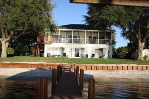 View of the back of the house from the dock of this beautiful home. 