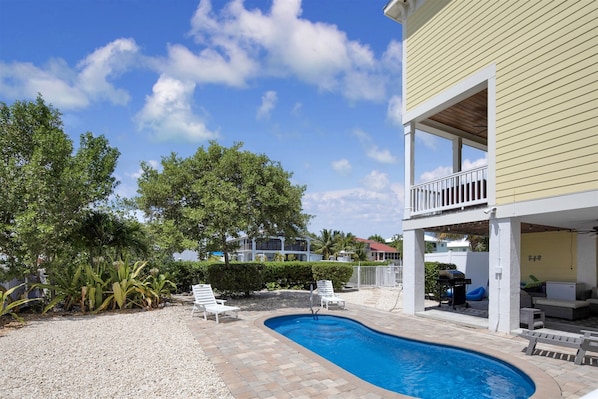 Side view of the home with private pool