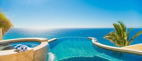 Gorgeous infinity edge pool blends in with Pacific Ocean!