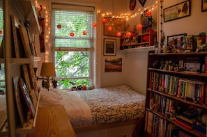 Small cozy bedroom with full size bed.