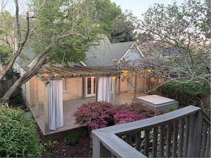 Porch view Cottage to the House. Privacy drapes are in each space