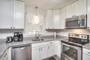 modern kitchen with garbage disposal, coffe maker, toaster etc,