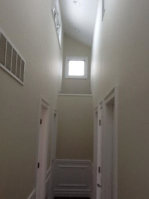 Upstairs hallway with cathedral ceiling